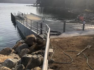 Newly constructed boat ramp and jetty with added walkways and bollards, enhancing access for bushwalkers on the Three Capes Track