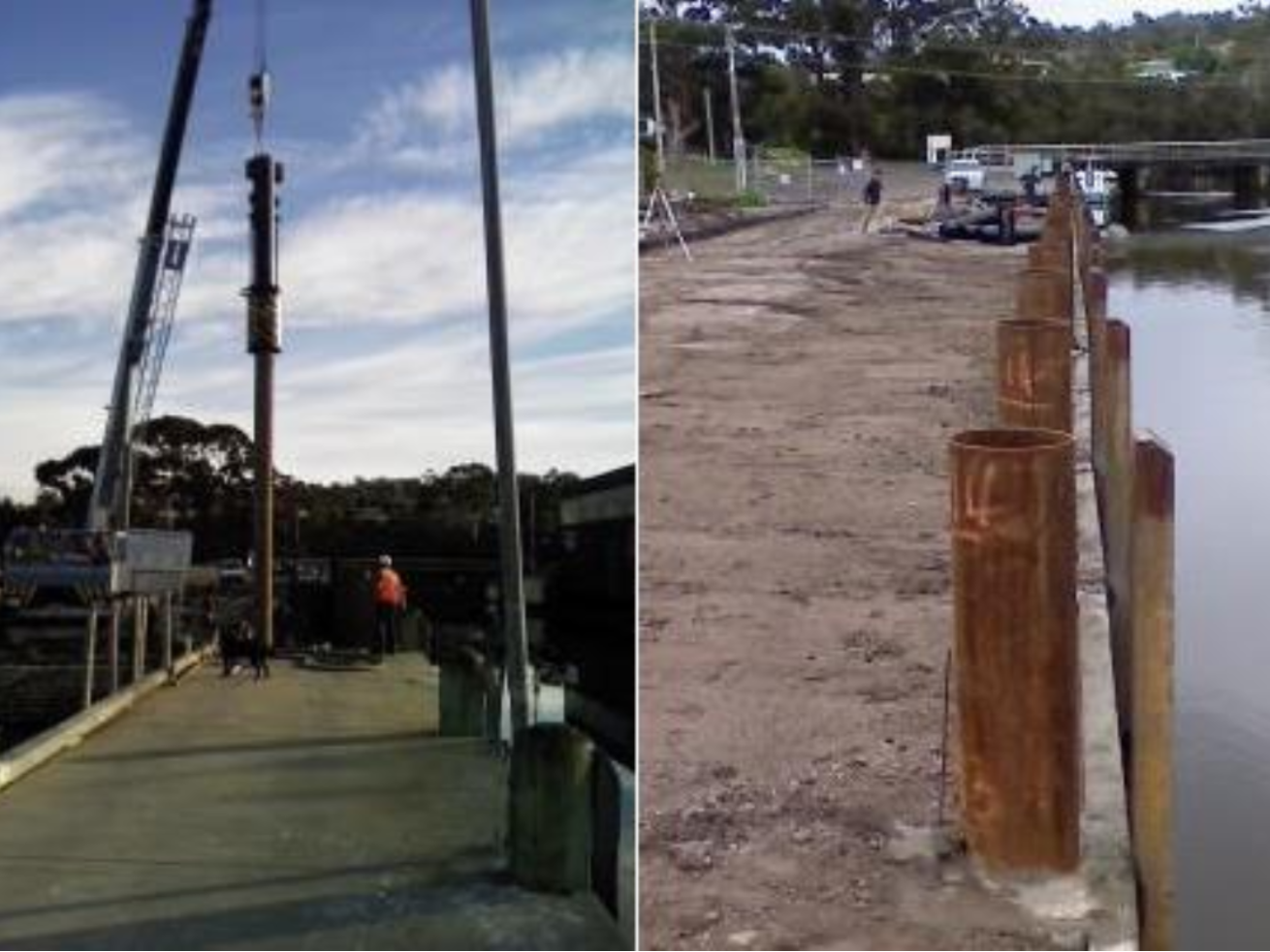 Workers are installing large steel piles along a waterfront using cranes and heavy machinery in a land-based piling operation.