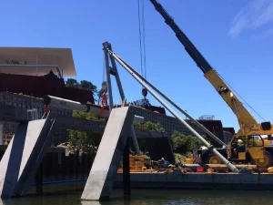 Structural framework of the MONA Turrell Wing under construction, featuring steel beams and scaffolding within the museum grounds